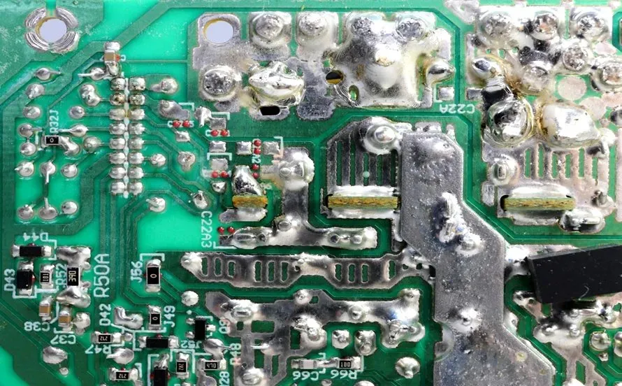 Defective PCB with visible manufacturing flaws