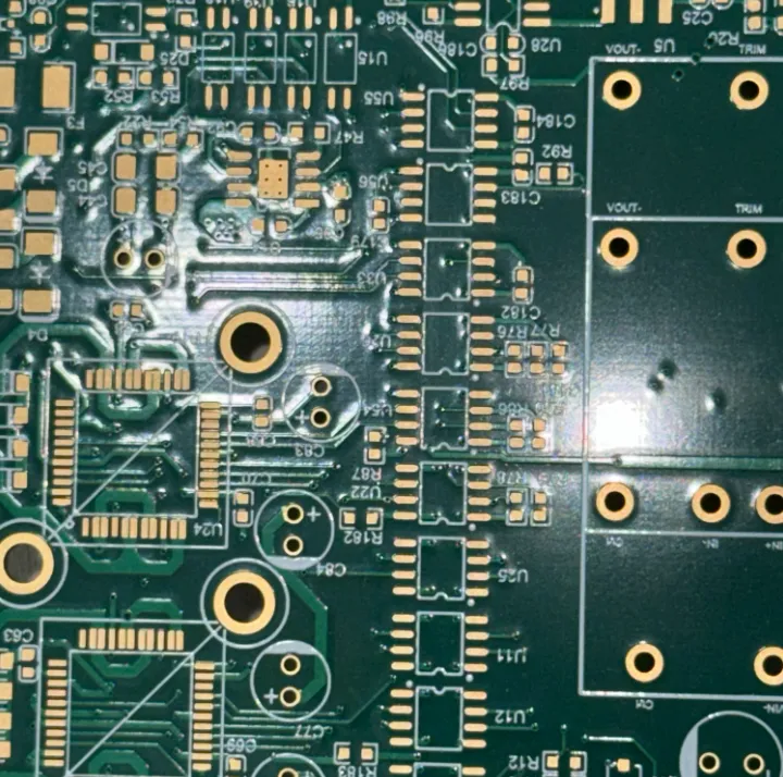 PCB showing silkscreen adhesion problems with peeling markings.