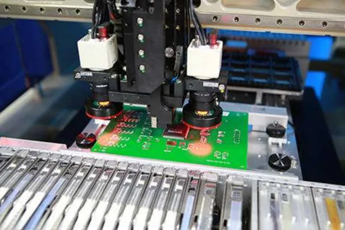 Automated pick-and-place machine during PCB assembly