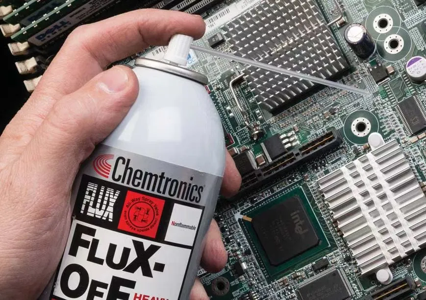 Cleaning PCB with water-soluble solder paste residue post-reflow.
