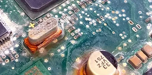 Damaged PCB due to harsh environmental exposure without protection.