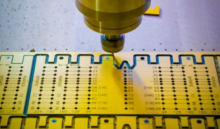 Thick PCB fabrication process showing drilling of vias in a multi-layer board.