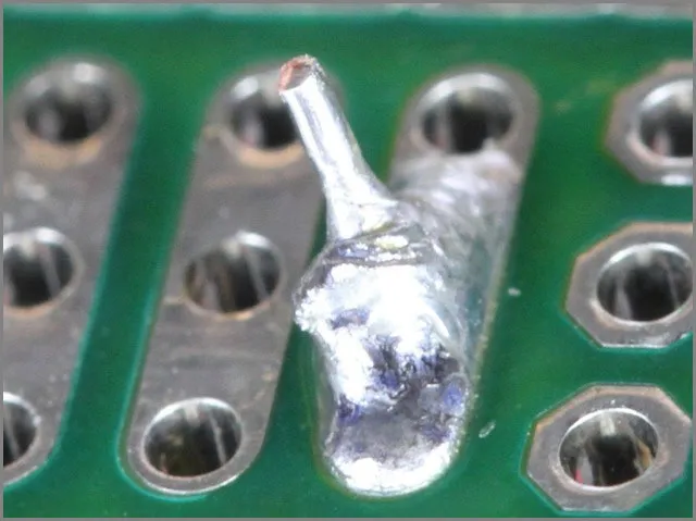 "Common SMD soldering mistakes including solder bridges."