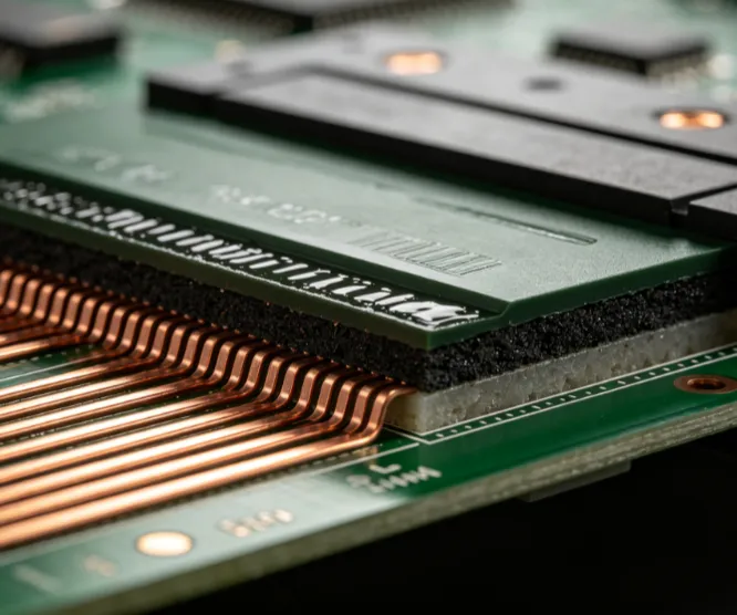 Microscopic cross-section showing solder mask coverage over copper traces in an automotive PCB