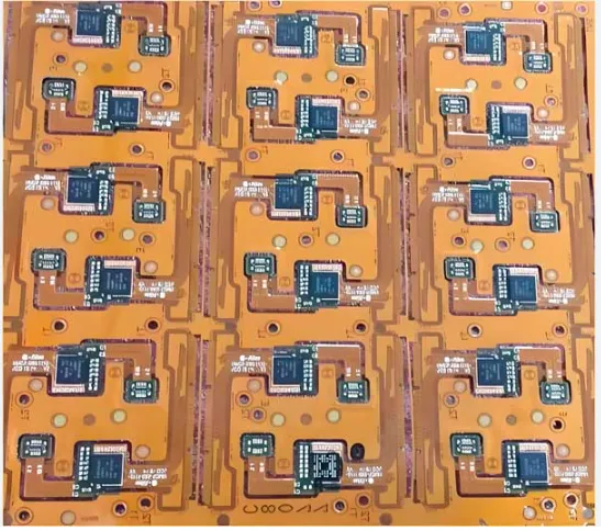 Top-down view of multiple flex PCB designs arranged on a manufacturing panel