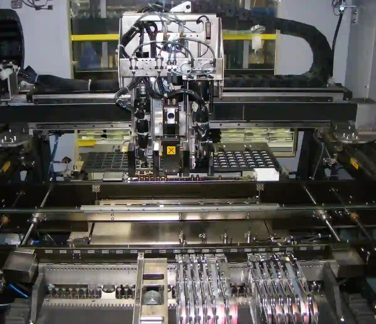 Automated pick-and-place machine during SMT PCB assembly