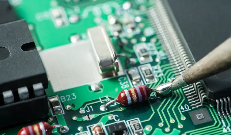 Thick PCB assembly process with components being soldered onto the board