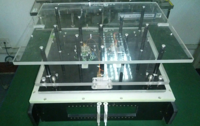 Comparison of bed-of-nails ICT fixture and flying probe tester for PCB testing.