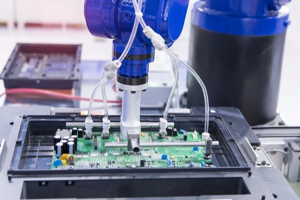 Solder paste inspection system checking PCB for defects.