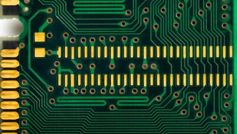 Close-up of PCB with OSP surface finish protecting copper traces.