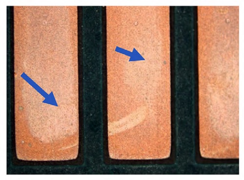 Damaged OSP coating on PCB showing copper oxidation.