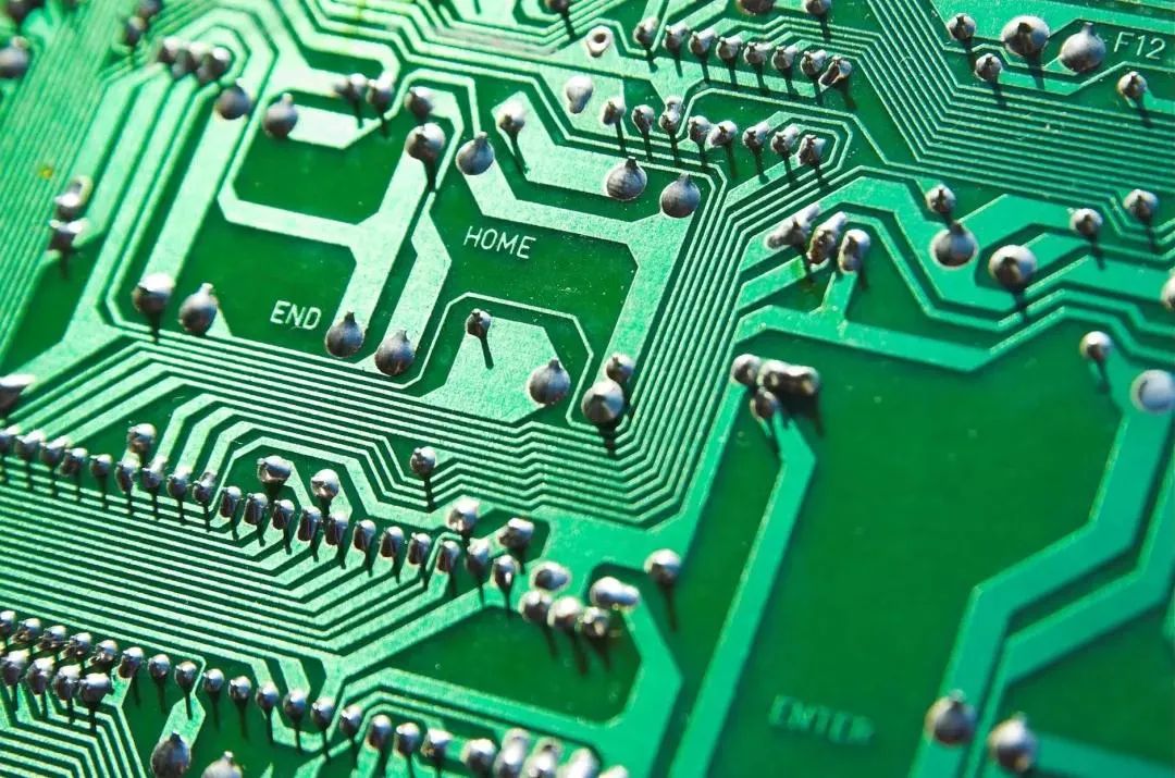 Through-hole components on a PCB with visible leads and soldering points.
