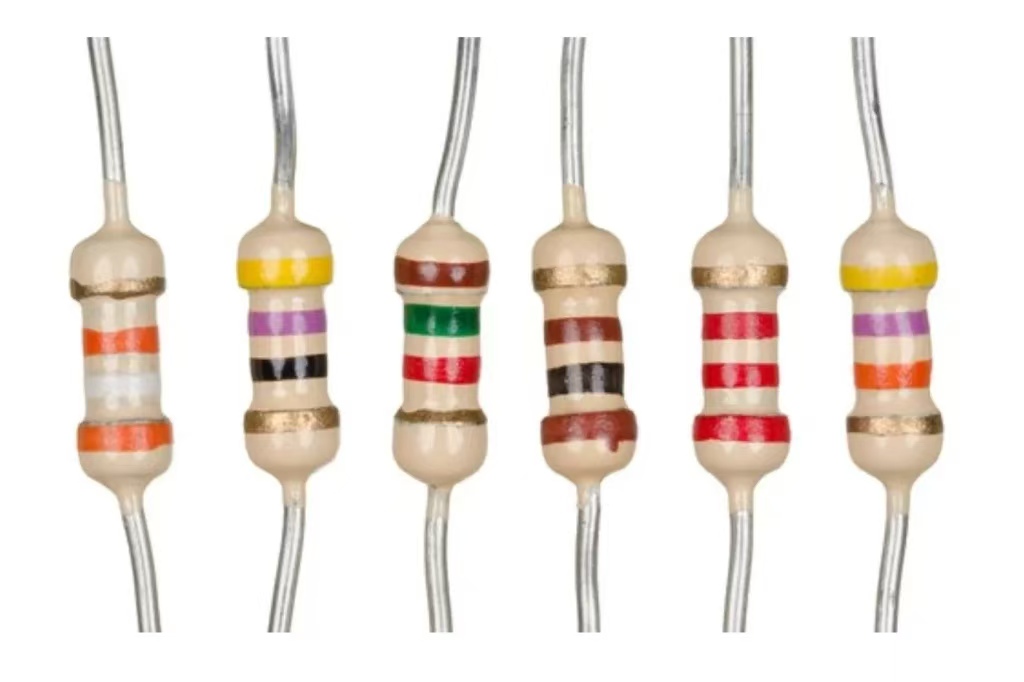 Through-hole resistor with color bands for resistance identification.