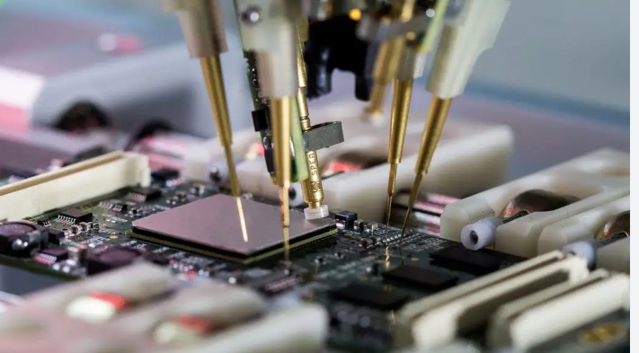 Close-up of needle probes in flying probe testing on a PCB