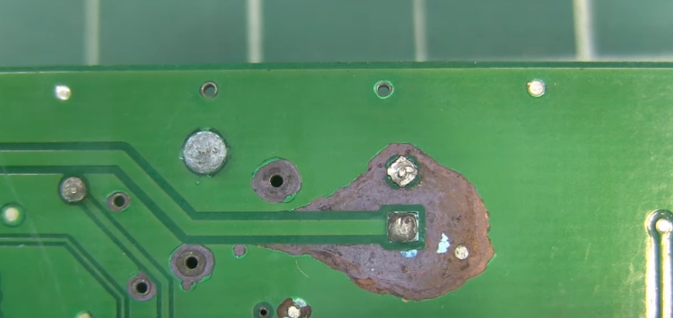 Damaged flexible PCB showing over-etching and trace issues