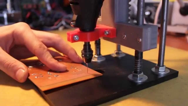 Close-up of precise holes drilled on a PCB using simple drilling techniques.