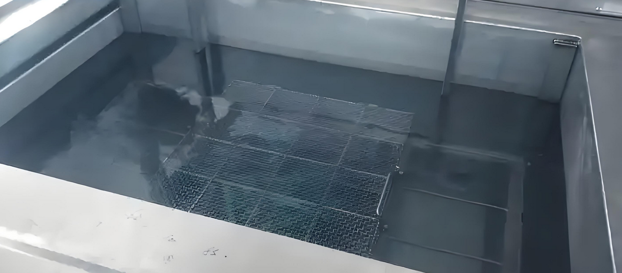 PCB undergoing ultrasonic cleaning in a specialized machine.