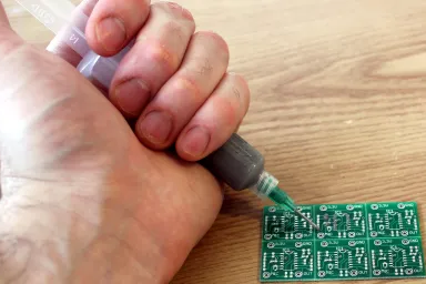 Testing solder paste flow from a syringe for manual application