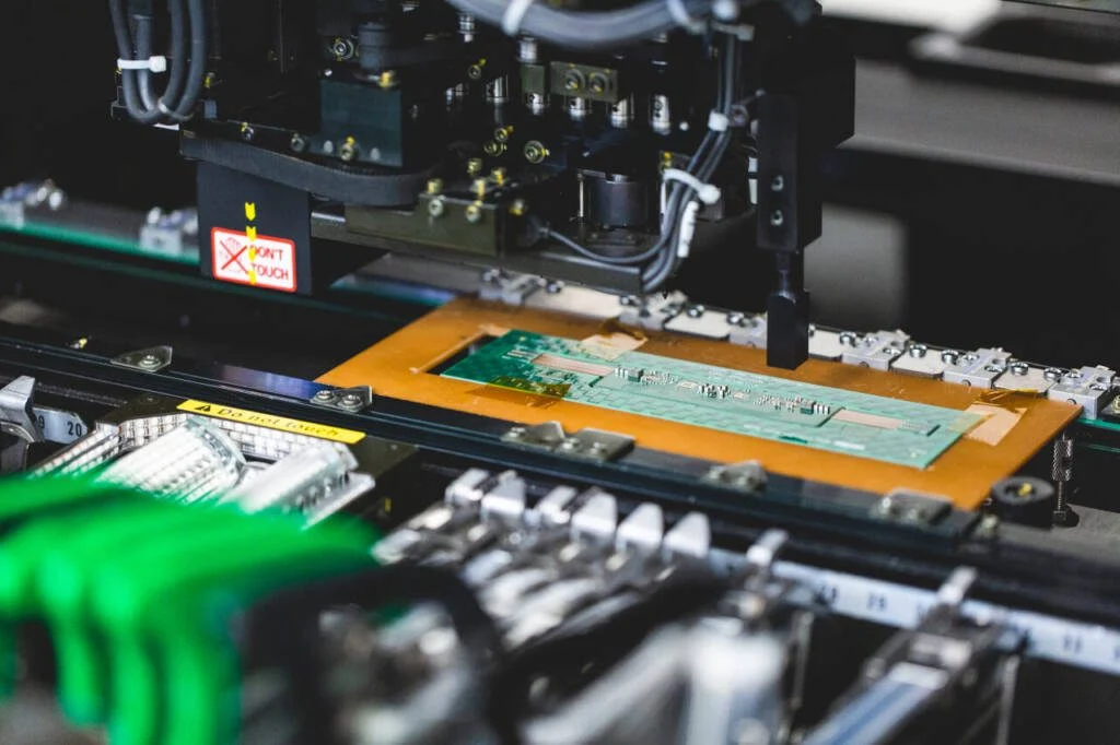 SMT machine assembling components on a rigid-flex PCB