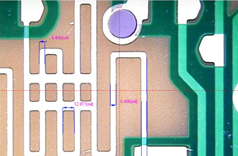Close-up of PCB traces with minimum trace spacing measurements
