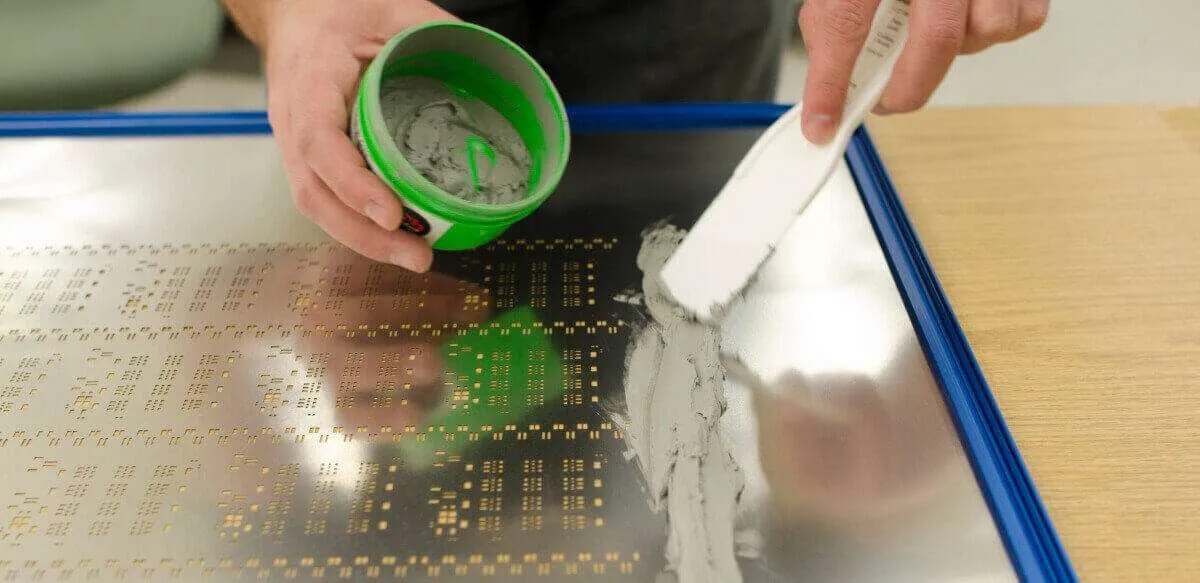 Solder paste printing on PCB using a stencil for SMT assembly