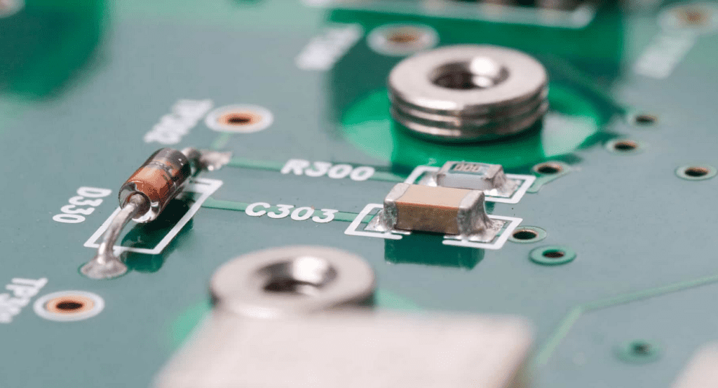 Axial lead component inserted into PCB for through-hole assembly