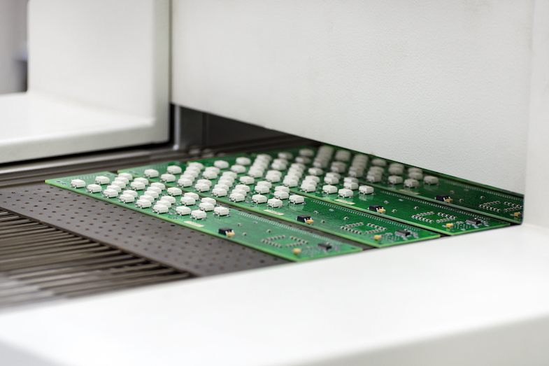 Reflow soldering oven used in SMT assembly under REACH compliance