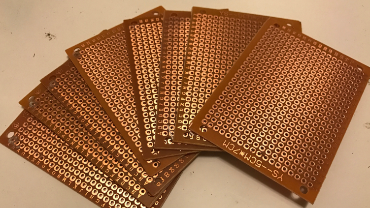Cutting an old PCB into a custom size for a breakout board."