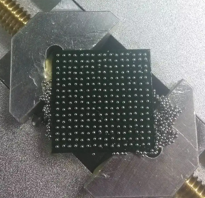 BGA reballing process using a stencil and solder balls