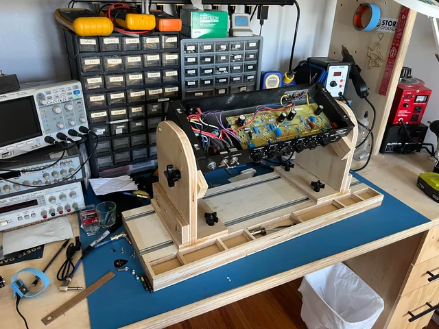 Testing audio amplifier PCB prototype on workbench