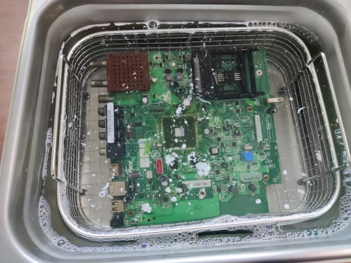 "Ultrasonic cleaning machine for assembled PCB contaminant removal."