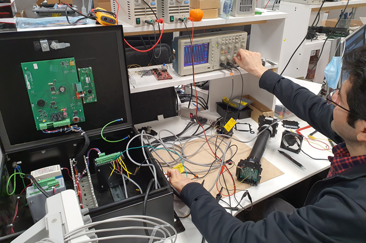 Prototype navigation PCB undergoing testing for design validation.
