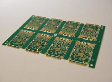 Irregular PCB shape with cutouts for advanced component placement.