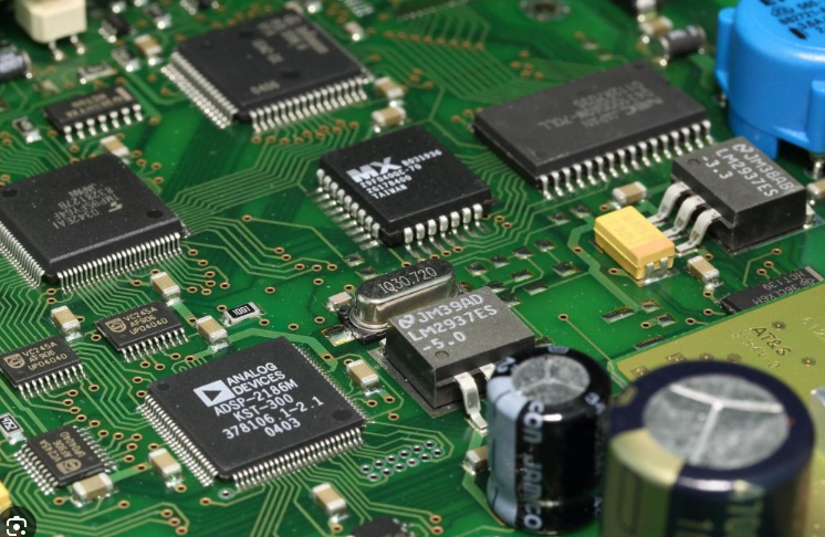 Partially assembled FR-4 PCB with soldered components