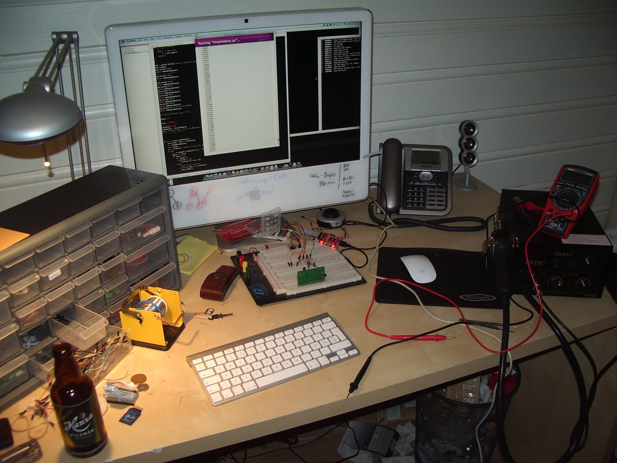 Workstation setup for reverse engineering ECU PCB with essential tools