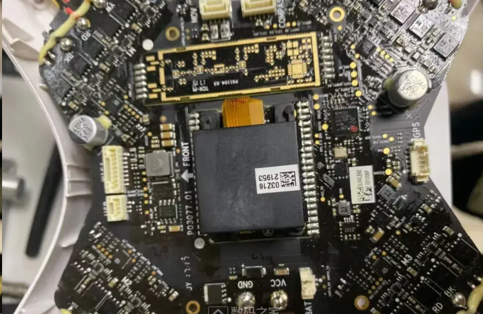 Drone flight controller PCB with labeled hardware components for firmware integration.