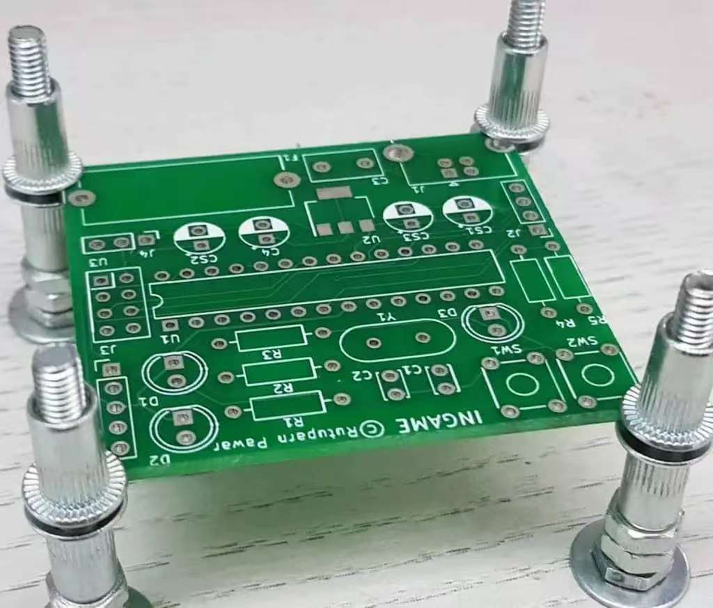 Assortment of PCB mounting hardware including screws, standoffs, and clips.