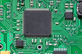 Microcontroller chip mounted on a PCB for embedded systems design."