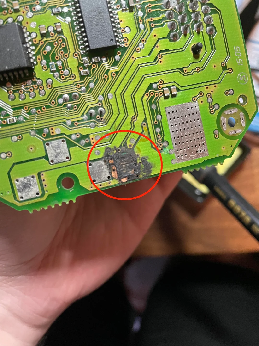 "Damaged ECU PCB with cracked solder joints"