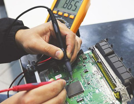 "Multimeter for electronics testing ECU PCB voltage"