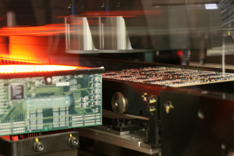 Space probe PCB with conformal coating tested in simulated space conditions.