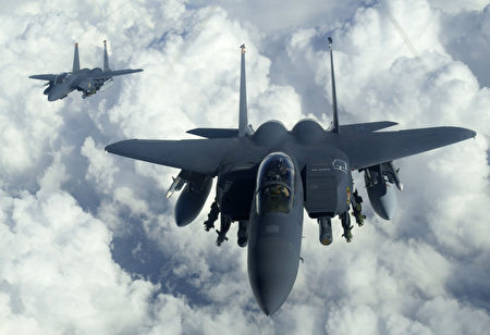 Military aircraft in flight highlighting the need for reliable aerospace PCB design.