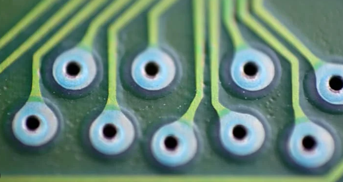 Close-up of plated through-hole with teardrop pad design in a PCB