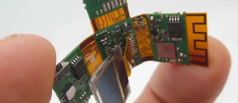 Semi rigid-flex PCB installed in a compact electronic device