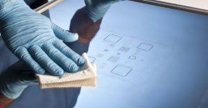 Cleaning a stencil to maintain performance in SMT assembly