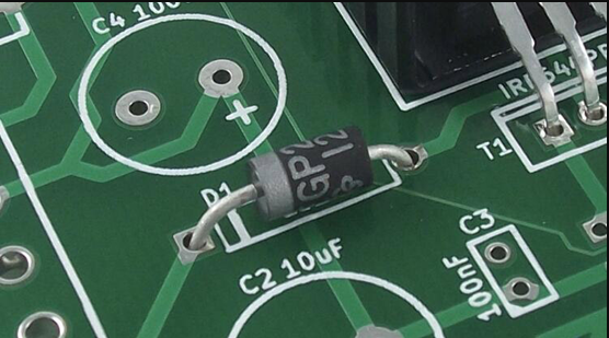 Close-up of PCB with silkscreen markings for component identification.