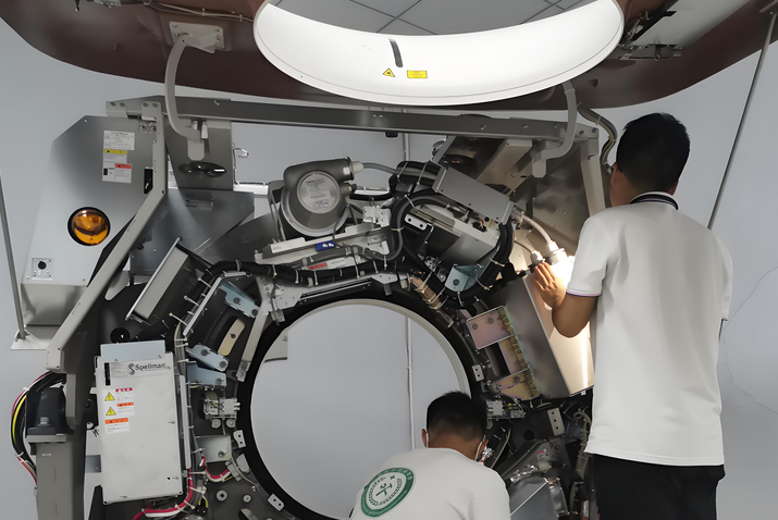 Technician performing component-level repair on a CT scanner PCB