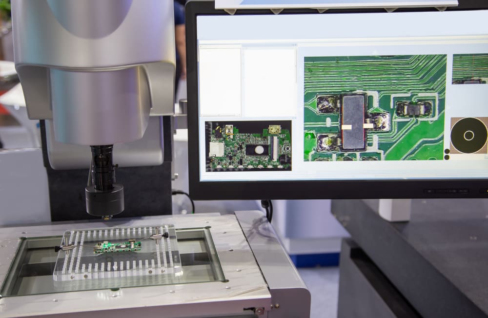 AOI machine inspecting PCB for component alignment.