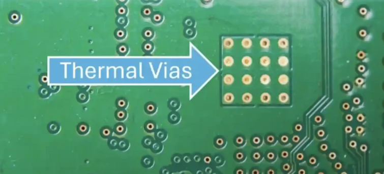PCB layout showing thermal vias under component for heat dissipation