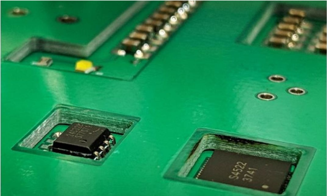 "Cross-section of embedded component PCB showing buried resistors and capacitors."